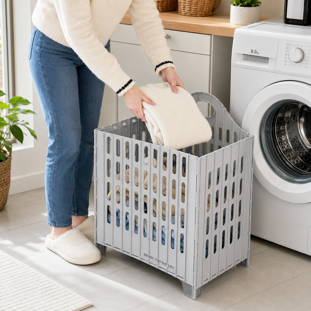 Laundry Hamper shown holding laundry in a bright organized bedroom